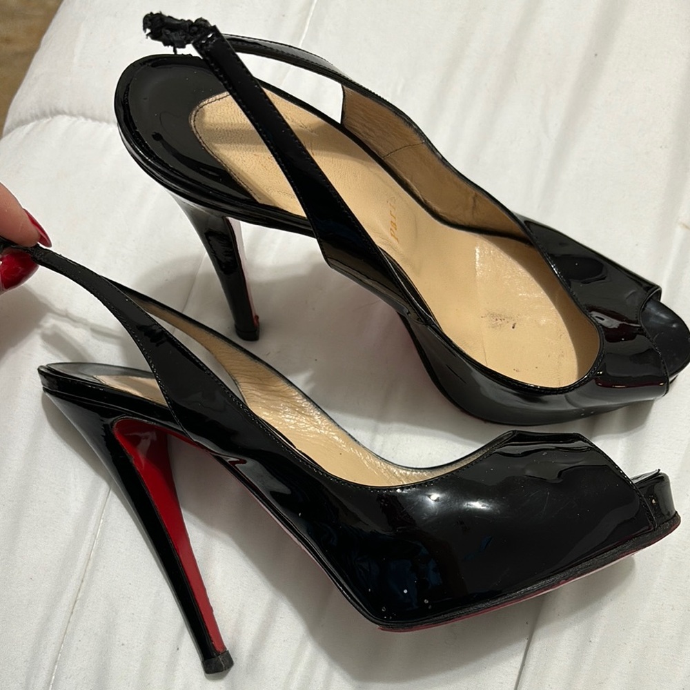 Christian Louboutin Black Heels with Peep-Toe Design and Stiletto Heel